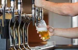 Bartender pouring a pint