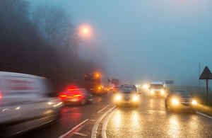 Road traffic on a busy road in low light conditions