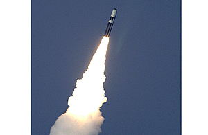 A Trident II D5 Missile breaking the surface, having been fired from HMS Vanguard, a Strategic Missile Submarine.