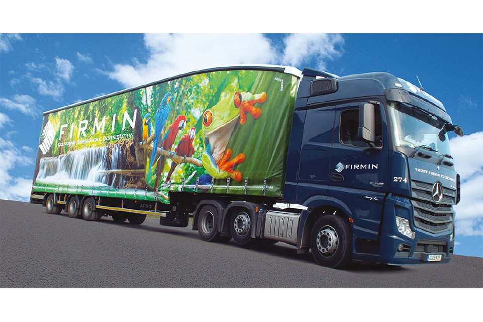 Tractor unit and longer semi trailer in the livery of Firmin distribution