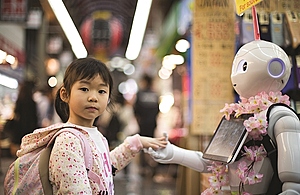 A girl greets a robot in an urban setting