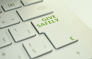 A keyboard with the words give safely on the enter key.