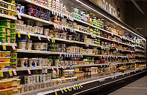 A photo of dairy products on supermarket shelves