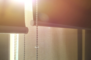 sun shining through window blinds