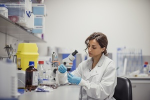 Woman doing work in infectious disease lab