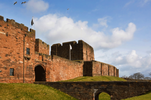 The walls, battlements and moat of Carlisle Castle.