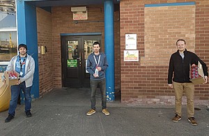 3 Sellafield Ltd employees standing outside the main labs on the Sellafield Site