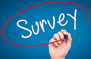 person writing survey on board