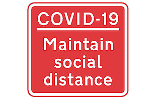 Image of COVID-19 maintain social distance sign.