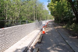 Flood wall units starting to be put into place along the Millennium  cycle path