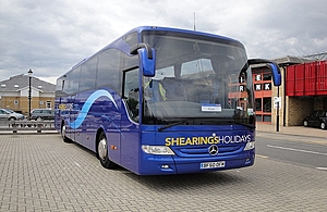Parked blue coach with Shearings Holidays branded on the front