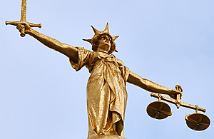 The statue of justice on top of the Old Bailey