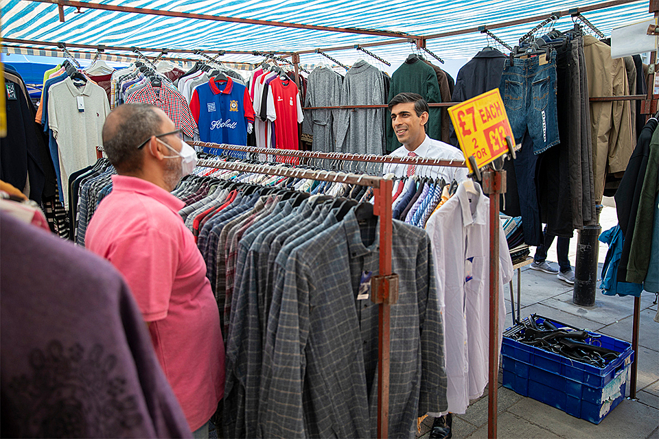Chancellor shops at outdoor market marking first step in plan to reopen economy