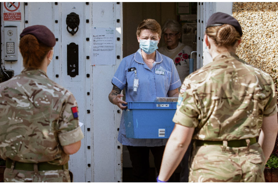 2 personnel from 12 Regiment Royal Artillery collecting mobile testing equipment.