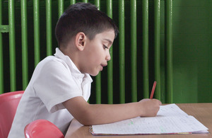 Child working at a desk.