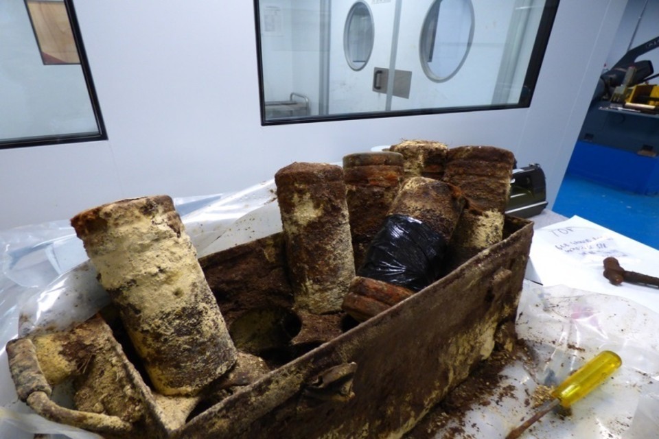 A box full of corroded mustard gas bombs pulled from a lake