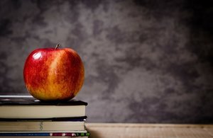 apple sitting on books