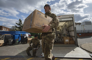 Soldiers delivering PPE.