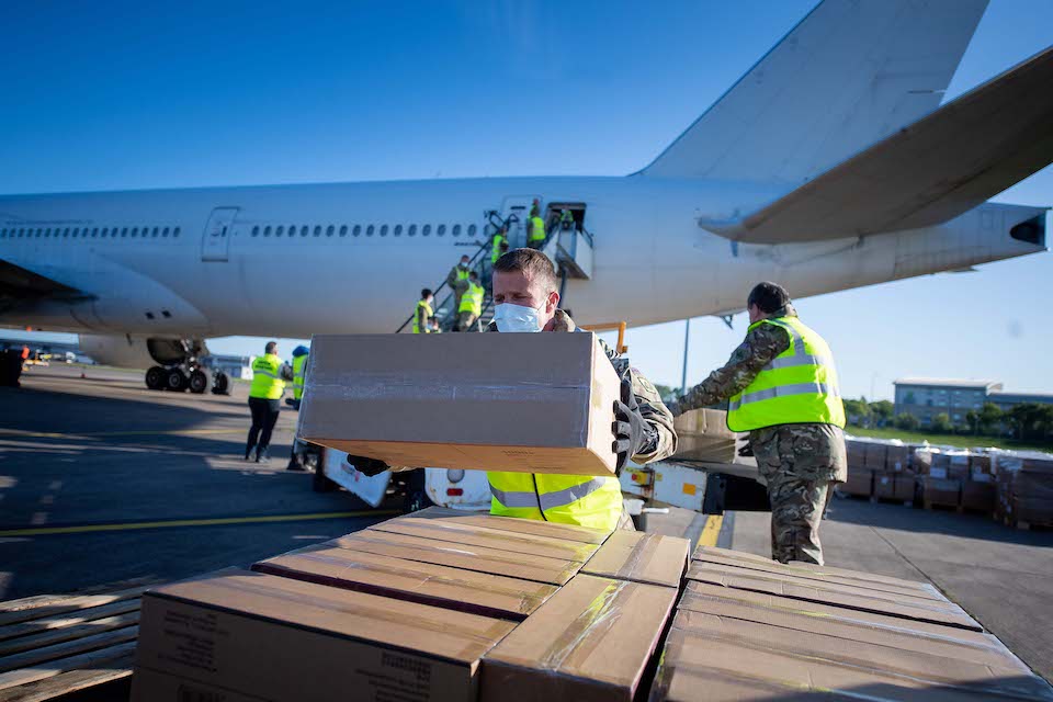 Personnel unloading an aircraft.