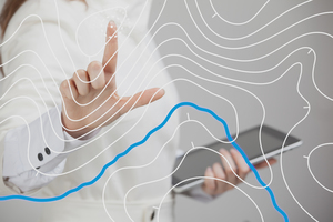 Scientist working with futuristic Geographic information system interface on a transparent screen.