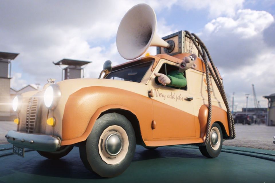 Image of the cartoon character Wallace, from Wallace and Gromit, leaning out of a car.