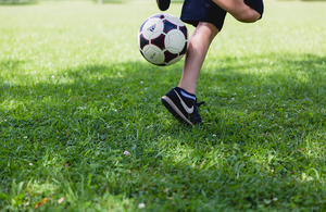 Football at a child's feet