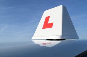 Photo of an L plate rooftop box on a driving school car