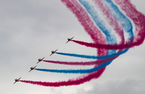 The Red Arrows putting on a colourful red and blue display