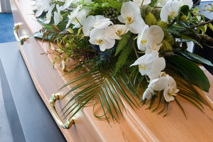 flowers on top of a coffin
