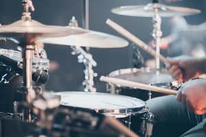 Close up of person playing drums