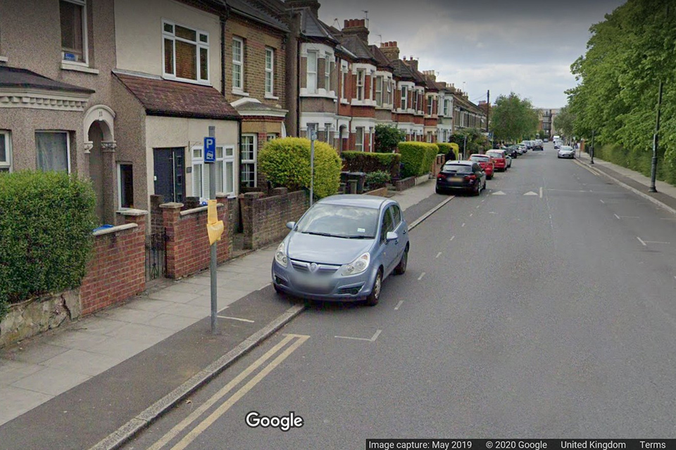 Image showing a residential London street with an exemption from the London-wide pavement parking prohibition.