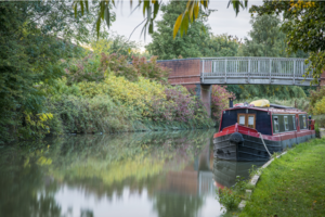 A canal boat in the Grand Union Canal in Milton Keynes.