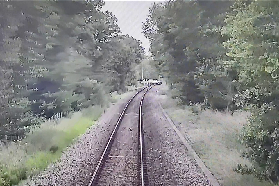 Image from forward facing CCTV from train 2D83, showing the first vehicle crossing the railway (courtesy of Greater Anglia)