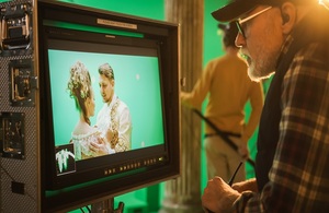 Director reviewing footage of film or TV programme