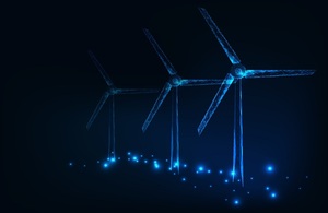 Image depicts a wind farm at night.