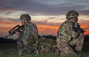 British and French paratroopers watch each other's backs after paratrooping into an exercise in southern France in 2018