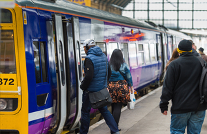 Image of a passenger getting on a train.