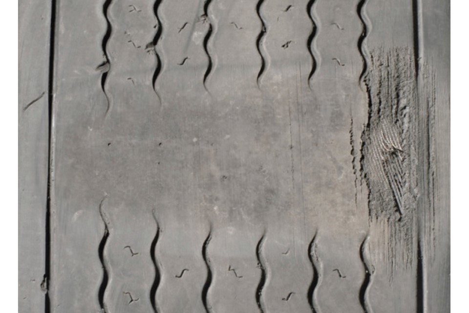 Flat spot, less than 1mm tread across three-quarters of the tyre tread and exposed cords in the tread area