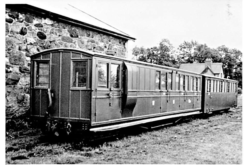 Image of 2 ‘Pickering Brakes’ railway coach in later Welsh Highland Railway days.