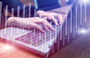 Hands typing on keyboard overlaid by digital graphic
