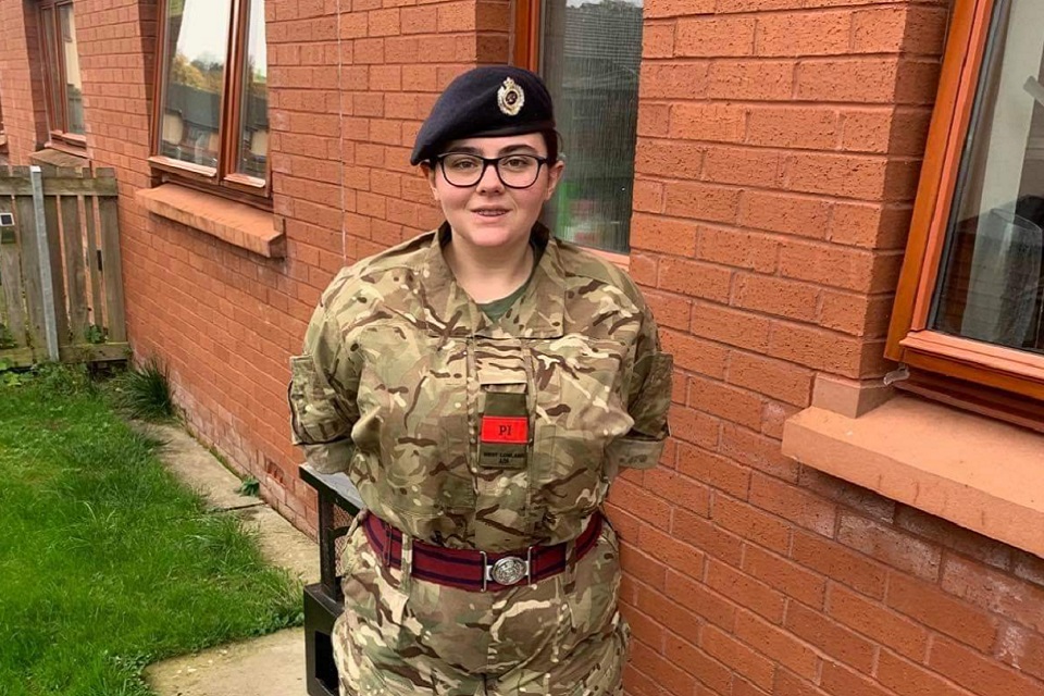 Caitlin Fitzimmons standing in Army Cadet uniform. 