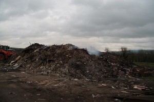A pile of smoking waste dumped