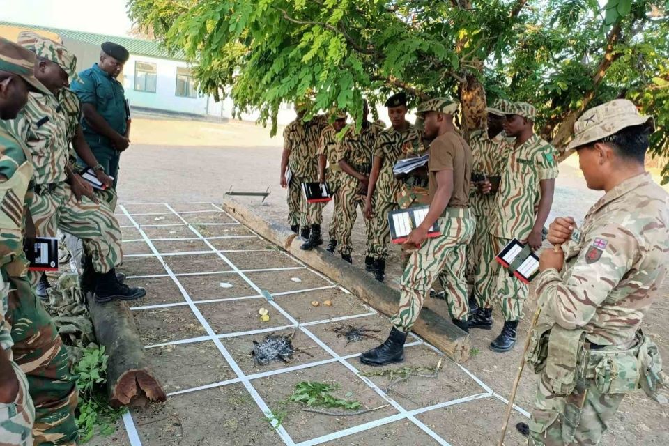 Zambian rangers learning tracking techniques