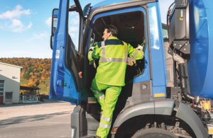 A picture of a haulier entering his cab