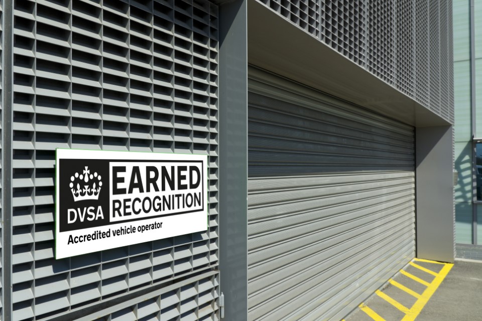 Photo of a DVSA earned recognition logo on the outside of a transport depot