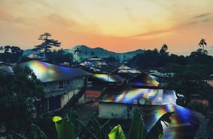 Artist's impression of flexible solar film deployed on rooftops in Africa