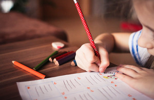 Child colouring on paper