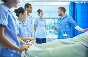 Student nurses around a patient's bed