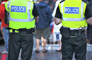 Image of 2 police officers standing.