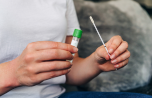 Person holding a coronavirus test swab